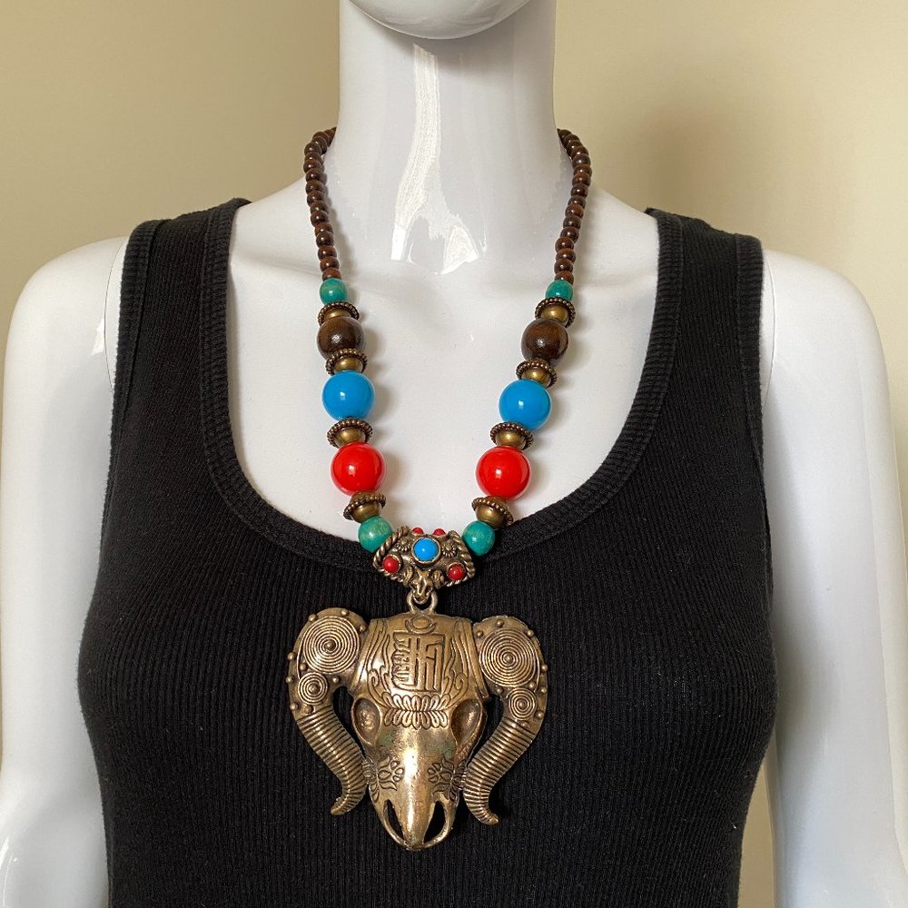Tibetan Necklace Yak Head. Circular design Horns, Red and Turquoise Color Beads